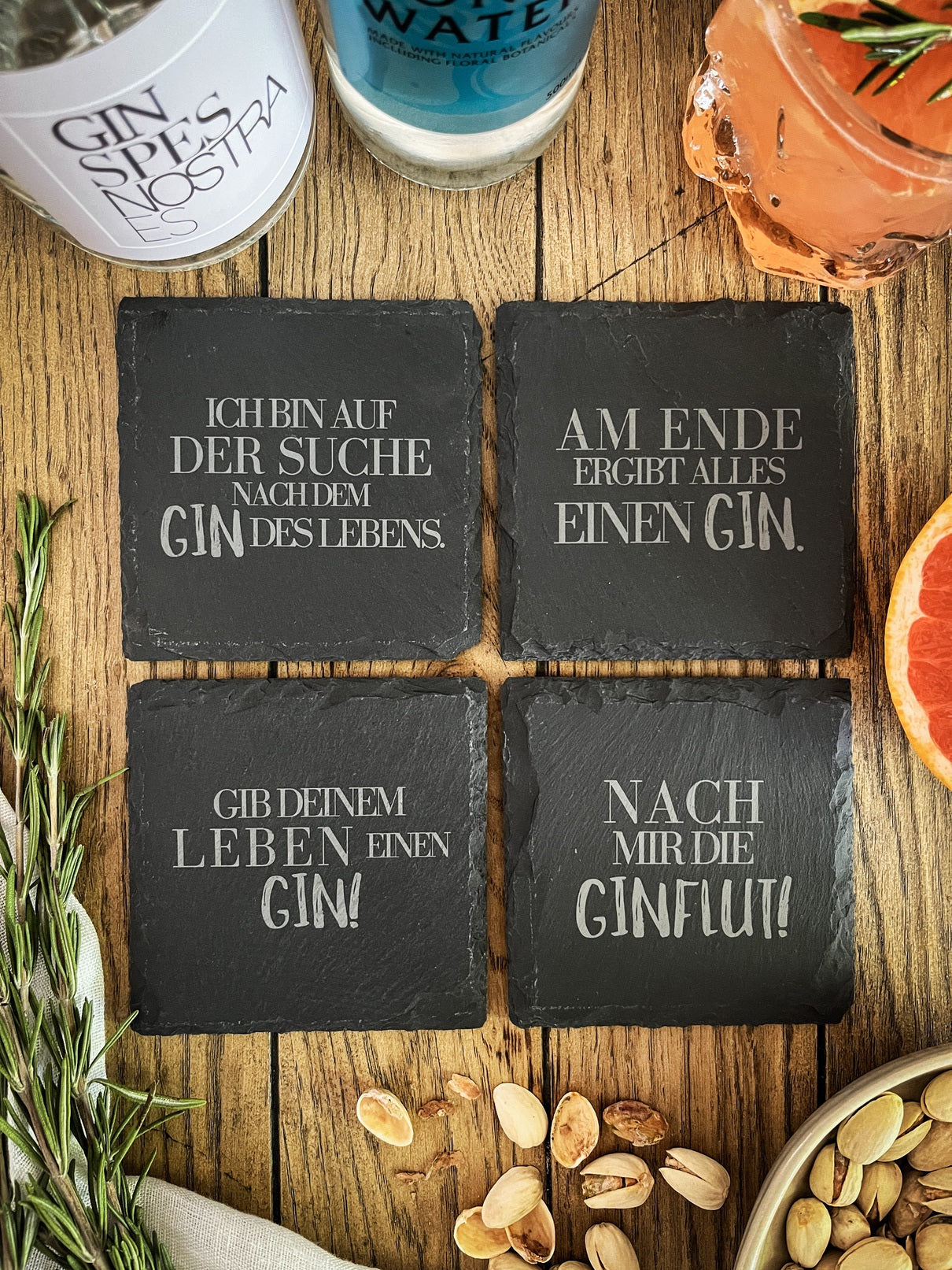 Slate gin coasters with various designs - set of 4