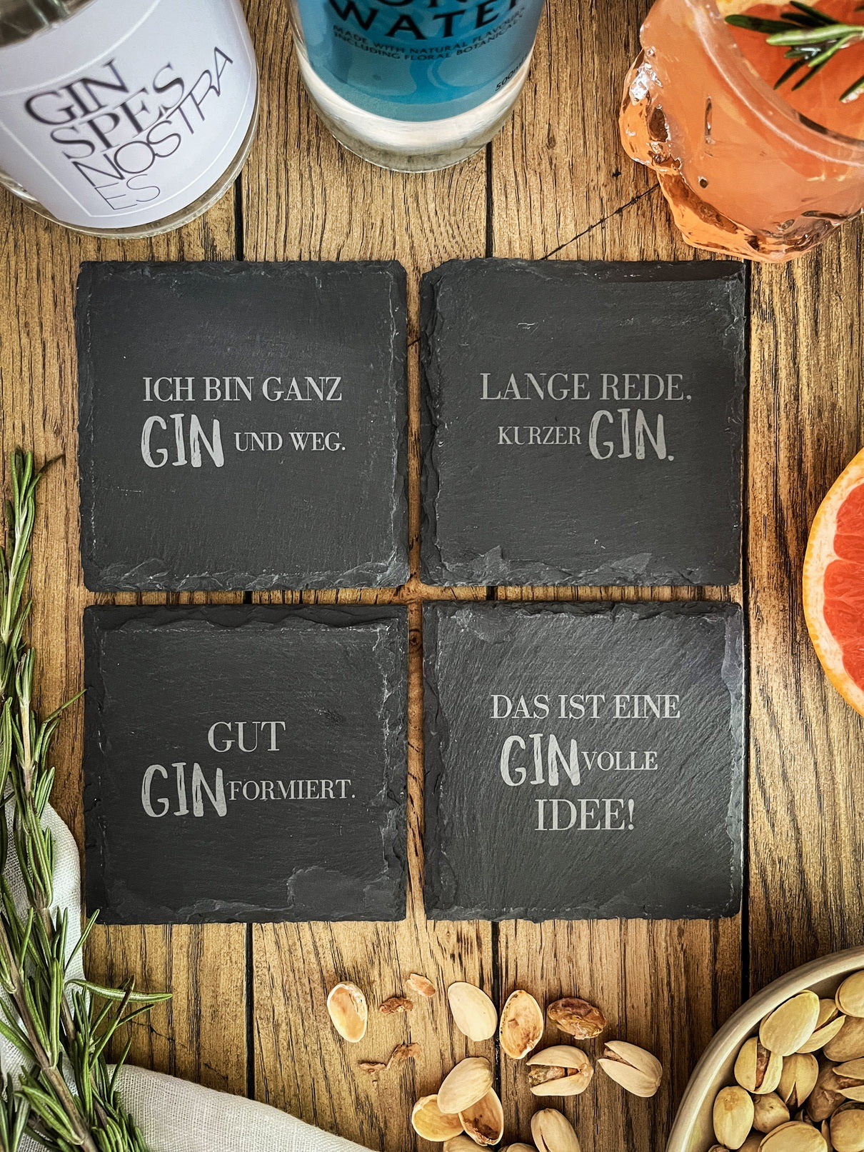 Slate gin coasters with various designs - set of 4